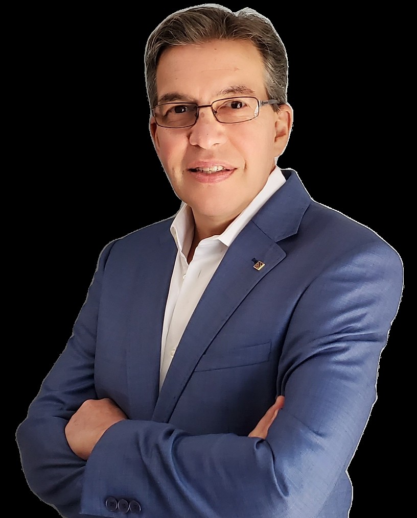 Man in blue suit smiling with arms crossed
